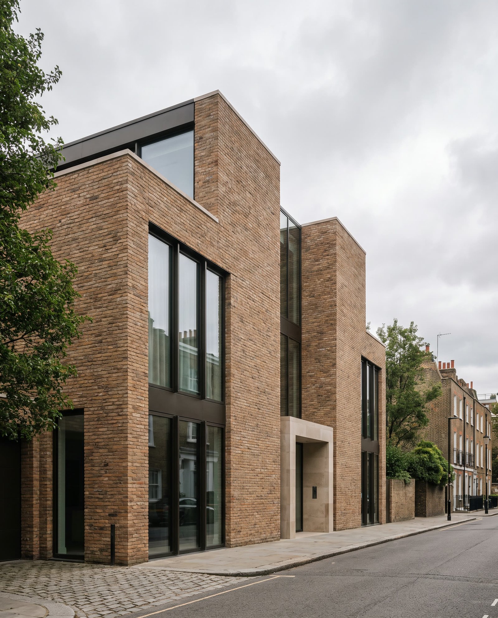 Contemporary urban residence in London with brick and glass facade.